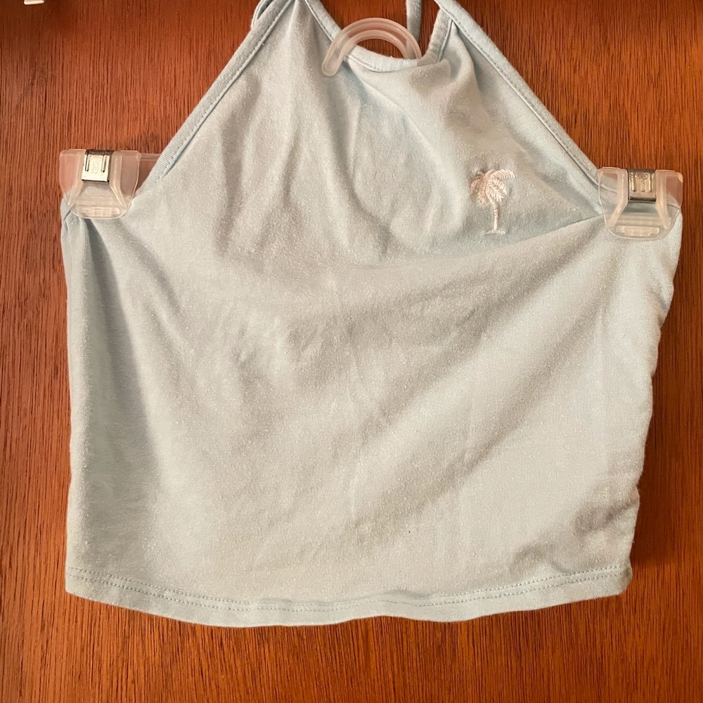 Blue halter crop top with a white palm tree